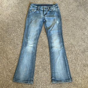 vintage distressed faded bootcut jeans